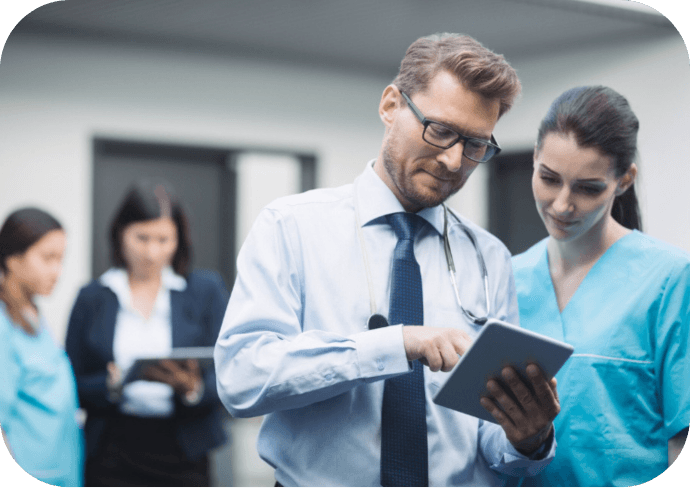 Doctors-reviewing-Risk-Stratification-data-on-tablet