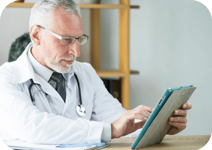 EHR- Doctor-reviews-patient-files-on-tablet