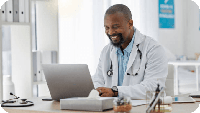 Gastroenterology-Smiling-doctor-working-on-laptop.