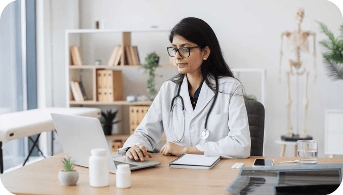 Mental-Health-Doctor-works-on-laptop-focused.