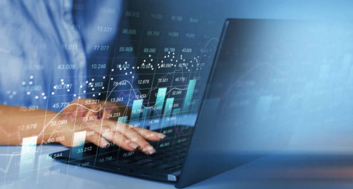 hands-on-laptop-analyzing-revenue-cycle-management-technology