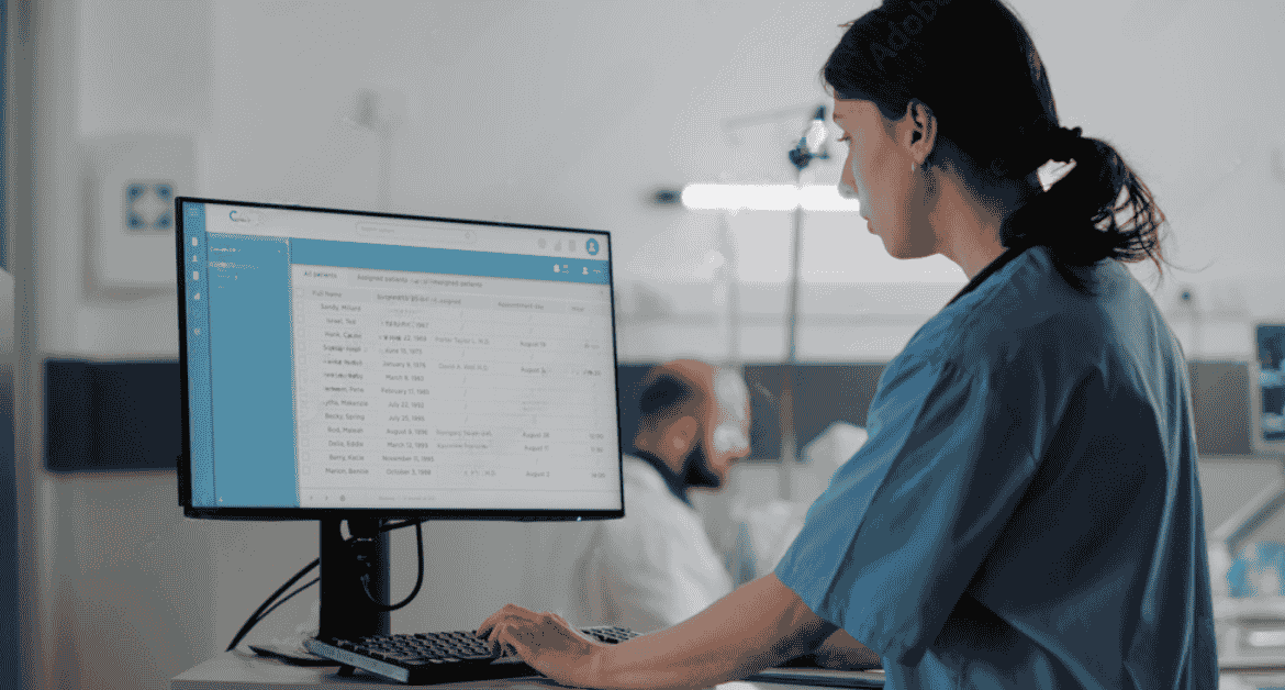 nurse-using-emr-to-review-remote-patient-monitoring-cpt-codes