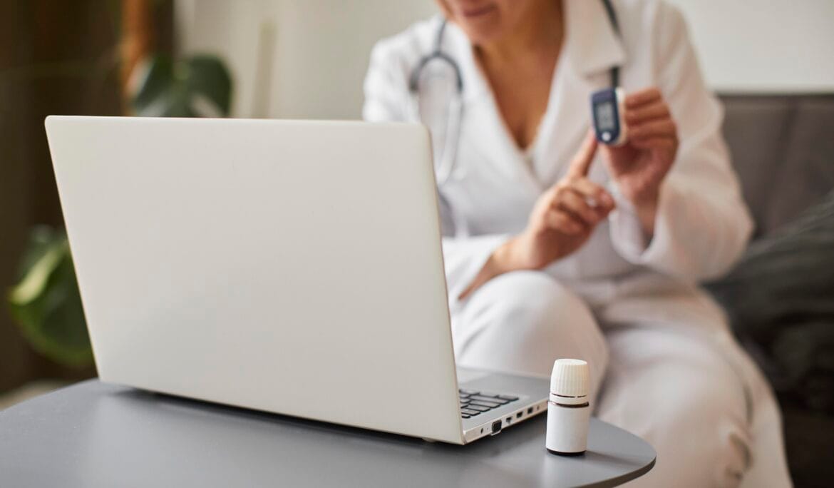 Remote Patient Monitoring-Doctor-demonstrates-oximeter-virtually.