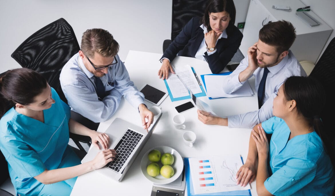 Medical-professionals-and-executives-in-a-focused-meeting.