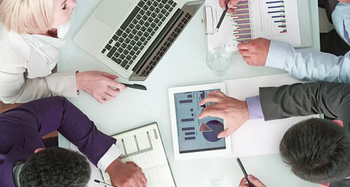 team-reviewing-data-for-chronic-care-management-solutions