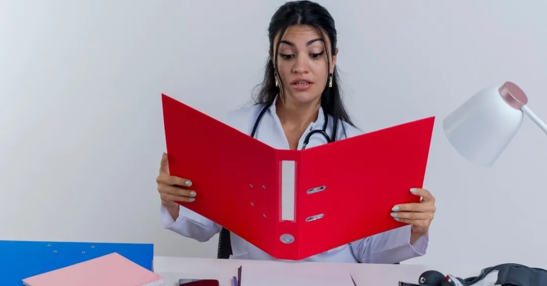 young-doctor-reviews-revenue-cycle-management-for-medical-billing-folder