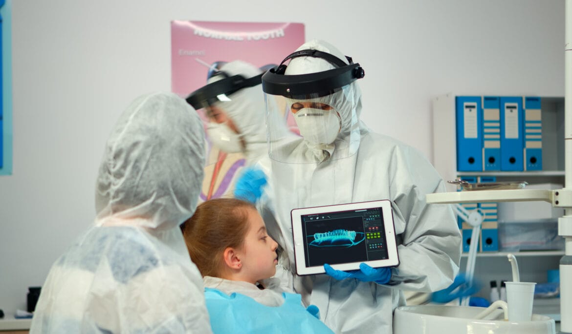 Doctor-showing-dental-x-ray-to-patient.