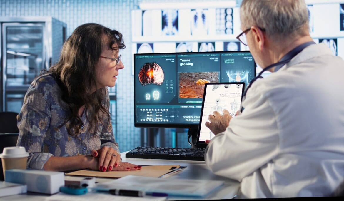 Health-professionals-discuss-scan-results-with-patient.