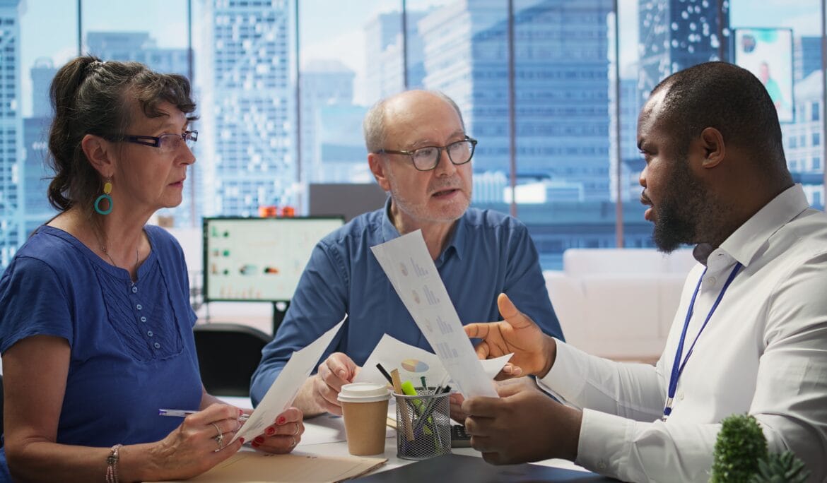 Clients-Reviewing-Investment-Options-with-Broker