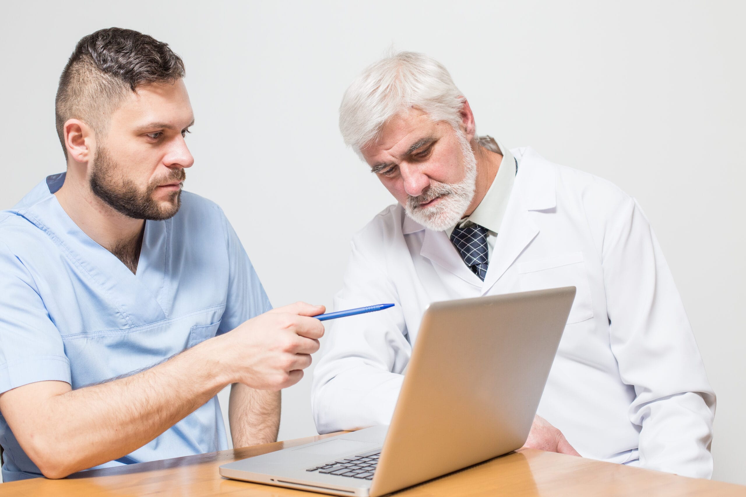 Doctors discuss laptop content, relevant to RPM vs RTM Billing.